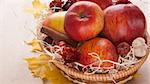 apples in a wicker basket on table