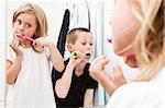 Siblings brushing teeths in the bathroom