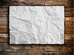 White crumpled paper on  panel wood background