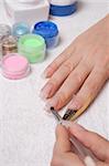 Manicure and design of nails, process of drawing of gel at escalating