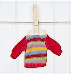 Warm Winter Striped Sweater on a Clothesline.  Holiday Concept.