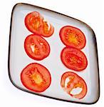 Fresh Sliced Tomatoes on a Plate Isolated on White with a Clipping Path.