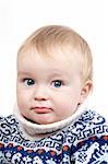 portrait of confused baby in switter on a white isolated background
