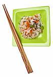 Snack of Chicken Fried Rice on a Green Plate with Chopsticks Isolated on White with a Clipping Path.