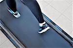 Girl's feet close-up when running on a treadmill