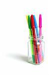 Ballpoint Pens in Glass Jar on White Background