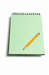 Note Pad and Pencil on white Background