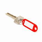 House key with blank label isolated on white background