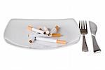 Several cigarettes on the plate with fork and knife