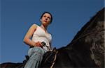 young teenager and her white black horse