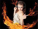 girl dances and ignites fire in the hands