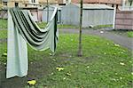 Curtain drying on string in backyard