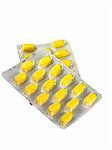 Yellow pills in blister isolated on a white background