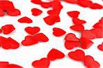Red hearts confetti on white background