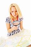 Attractive young blonde studying map over white background