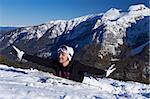 Young snowboarder is having fun on snowboard