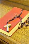 Hymnal  book and wooden rosary bead- detail