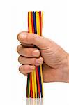 hand holding colorful mikado sticks to start game