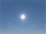 Sun background with beams at a clear sky