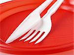 fork and knife in red disposable plate