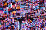 Brightly coloured woven belts in craft market, Ecuador