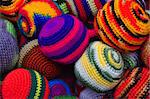 close up of brightly coloured woolen juggling balls