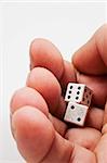 Isolated closeup of two dice ready to throw