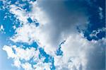 Blue sky with some white puffy clouds