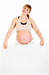 Happy beautiful pregnant woman holding blank billboard  isolated on white