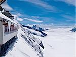 Jungfraujoch in Swiss Alps showing station and distant peaks above clouds