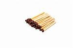 Group of matches in a row on a white background