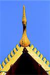 detail of ornately decorated temple roof in bangkok, thailand