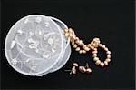 White embroidered jewelery box with a string of pearls