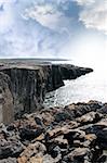 view from the cliffs edge on a rocky landscape of the burren in county clare ireland