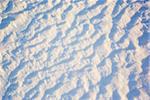 Texture of the snow surface, as a winter abstract background