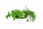 dill and parsley at plate isolated on a white background