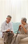 Senior doctor talking with his patient