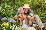 Man hugging his woman in the garden