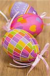Colorful Easter eggs decoration on wooden background
