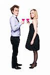 Young couple toasting with pink drink. Two people drinking. Studio photo., isolated.