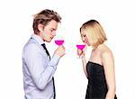 Young couple toasting with pink drink. Two people drinking. Studio photo., isolated.