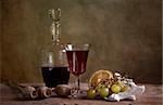 Still life with red wine and grapes with lemon