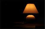 Ancient lamp on table in the dark