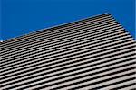 Abstraction of curves for modern building on a clear blue sky.