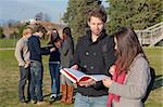 College Students Walking and Talking at Park