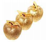 Golden apples lying on a white background