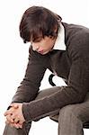 Depressed young man. Isolated on white background.