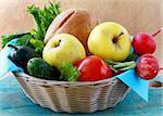 picnic basket full of fresh food bread, fruit and vegetables