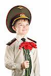 Portrait of young boy in Ministry of Defense Russian Federation cap and military uniform with red flowers