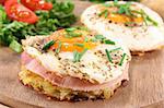 Potato pancakes with ham, egg, pepper, chives and fresh salad